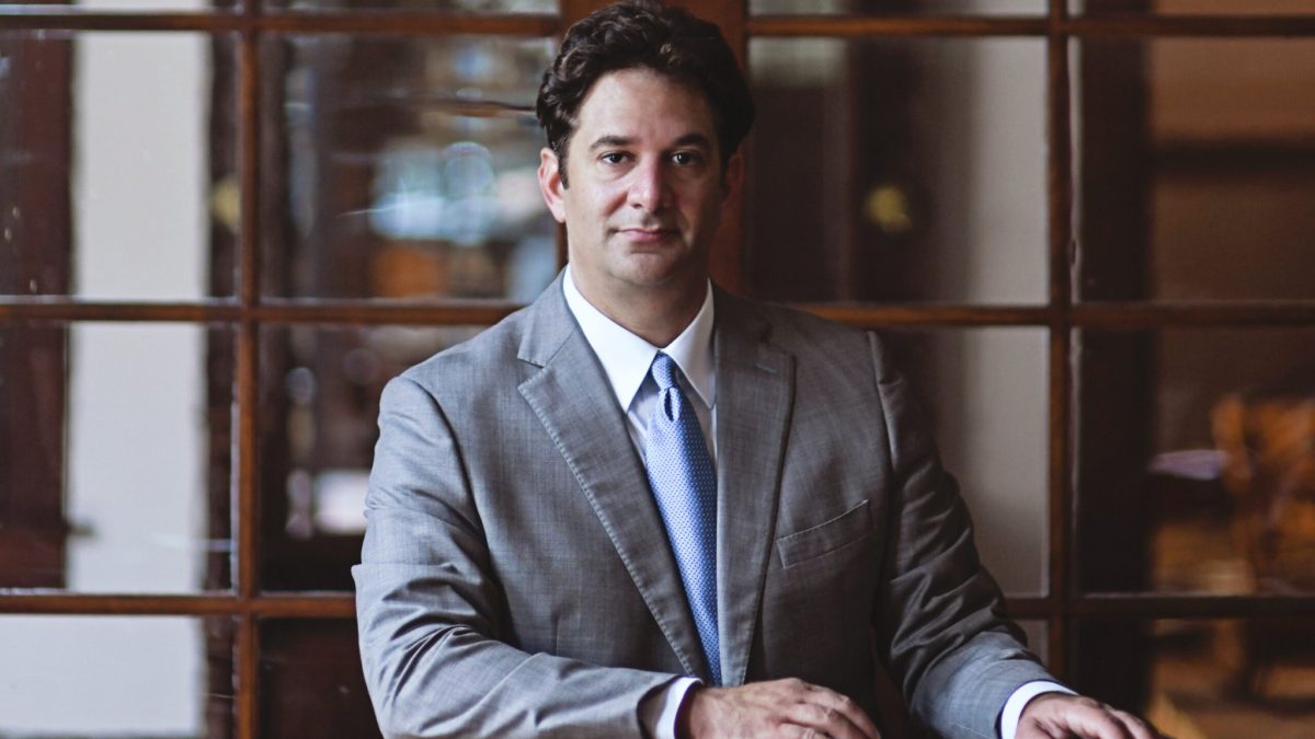 R. Reagan Sahadi, personal injury attorney, in a formal office setting
