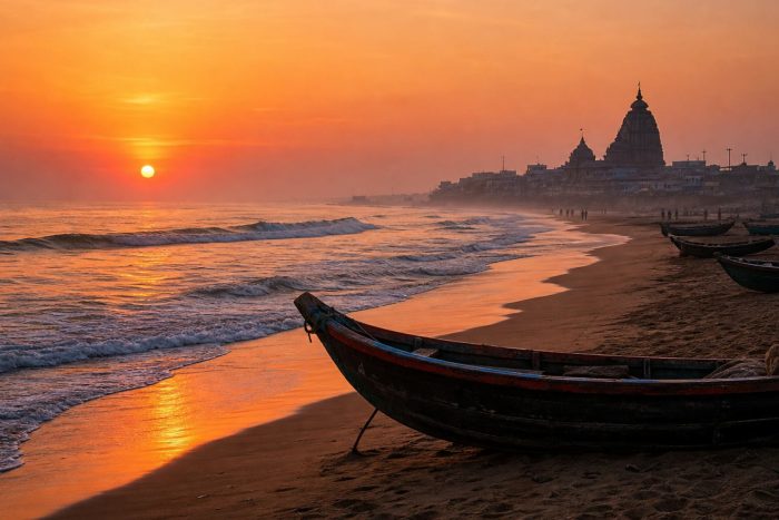 Sunrise over Puri Beach with fishing boats and a temple spire silhouette in the distance